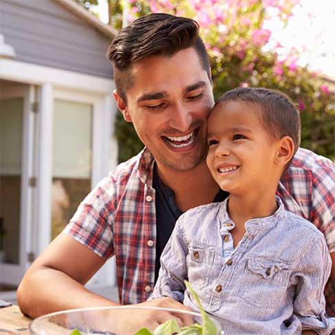 Father Smiling happily with Child
